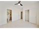 Bright bedroom with a ceiling fan, en-suite bathroom, and a closet, offering a comfortable and functional space at 39006 N Habitat Circle Cir, Cave Creek, AZ 85331