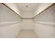 Walk-in closet with custom shelving and tile flooring, offering ample storage space at 39006 N Habitat Circle Cir, Cave Creek, AZ 85331