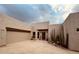 Contemporary single-story home with a two-car garage and desert landscaping under a cloudy sky at 39006 N Habitat Circle Cir, Cave Creek, AZ 85331