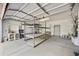 Spacious garage with ample storage shelves and organized layout, providing a functional space for parking and storage at 39006 N Habitat Circle Cir, Cave Creek, AZ 85331