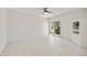 Spacious living room with tile flooring, a ceiling fan, and sliding glass doors leading to the outdoor space at 39006 N Habitat Circle Cir, Cave Creek, AZ 85331