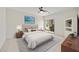 Bright main bedroom with sliding glass door and tiled floors, complemented by decorative wall art at 39006 N Habitat Circle Cir, Cave Creek, AZ 85331