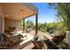 Secluded outdoor patio offering lounging space with desert views and comfortable seating at 39006 N Habitat Circle Cir, Cave Creek, AZ 85331