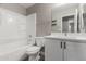 Bathroom featuring a tub, toilet, vanity, and mirror at 4002 E Melinda Ln, Phoenix, AZ 85050