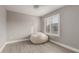 Bright, minimalist bedroom with a ceiling fan and a large window with shutter blinds at 4002 E Melinda Ln, Phoenix, AZ 85050