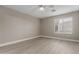 The bedroom is well lit with a ceiling fan and has light colored walls and flooring at 4002 E Melinda Ln, Phoenix, AZ 85050