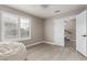 Clean bedroom featuring a window with shutters, light walls, and new floors at 4002 E Melinda Ln, Phoenix, AZ 85050