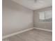 Comfortable bedroom featuring light wood floors and a bright window at 4002 E Melinda Ln, Phoenix, AZ 85050