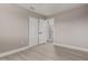 Bedroom featuring light wood floor, ceiling fan, and closet with sliding doors at 4002 E Melinda Ln, Phoenix, AZ 85050