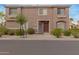 Charming two-story townhome with well-maintained landscaping and a welcoming front entrance at 4002 E Melinda Ln, Phoenix, AZ 85050
