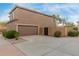 Spacious two-car garage with ample driveway space and a neatly fenced side yard at 4002 E Melinda Ln, Phoenix, AZ 85050