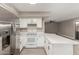 Bright kitchen featuring stainless steel refrigerator and white appliances and countertops at 4002 E Melinda Ln, Phoenix, AZ 85050