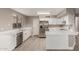 Kitchen featuring stainless steel appliances, white cabinetry, and light countertops at 4002 E Melinda Ln, Phoenix, AZ 85050