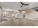 Open-concept living space flowing into the kitchen, featuring modern flooring and neutral decor at 4002 E Melinda Ln, Phoenix, AZ 85050
