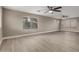 Open-concept living area with light wood floors and bright windows at 4002 E Melinda Ln, Phoenix, AZ 85050