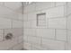 Nicely tiled shower space with shampoo niche and brushed nickel shower head at 4002 E Melinda Ln, Phoenix, AZ 85050