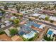 Aerial view of the home and neighborhood featuring mature trees, a pool, and solar panels at 4408 N 28Th Pl, Phoenix, AZ 85016