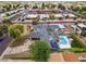 Expansive aerial view of a property featuring a pool, solar panels, lush landscaping, and outdoor entertaining spaces at 4408 N 28Th Pl, Phoenix, AZ 85016