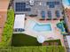 Aerial view of the home showing solar panels, new pool, backyard with grass and garden beds at 4408 N 28Th Pl, Phoenix, AZ 85016