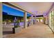 Inviting covered patio with brick flooring overlooks the sparkling pool and lush landscaping at 4408 N 28Th Pl, Phoenix, AZ 85016