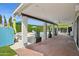 Covered patio with ceiling fan, brick flooring, potted plants, overlooking a pool at 4408 N 28Th Pl, Phoenix, AZ 85016