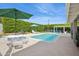 View of private backyard, pool, seating area, lounge chair, and manicured hedges at 4408 N 28Th Pl, Phoenix, AZ 85016