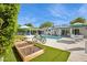 Spacious backyard with a pool, landscaping, and outdoor dining area at 4408 N 28Th Pl, Phoenix, AZ 85016