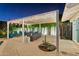 Inviting backyard with a covered patio, comfortable seating, manicured lawn, and starry night sky, perfect for outdoor gatherings at 4408 N 28Th Pl, Phoenix, AZ 85016