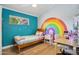 Cheerful bedroom with rainbow wall art, wood floors, and bright decor at 4408 N 28Th Pl, Phoenix, AZ 85016