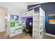 bedroom features an elevated bed with a built-in desk area and storage at 4408 N 28Th Pl, Phoenix, AZ 85016