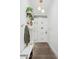 Bright entryway features coat rack with plants and a contemporary white door with glass inserts at 4408 N 28Th Pl, Phoenix, AZ 85016
