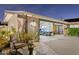 Exterior elevation showcasing covered parking, well-maintained landscaping, and a classic blue car at 4408 N 28Th Pl, Phoenix, AZ 85016