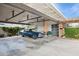 Well-kept single-story home with lush landscaping, carport, and a classic blue Chevrolet parked outside at 4408 N 28Th Pl, Phoenix, AZ 85016