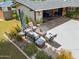Charming seating area, lush landscaping, mature trees and attached carport are showcased in the home's front yard at 4408 N 28Th Pl, Phoenix, AZ 85016