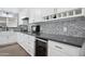 Chic kitchen boasts white cabinetry, modern appliances, and elegant countertops at 4408 N 28Th Pl, Phoenix, AZ 85016