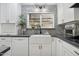 Modern kitchen with a farmhouse sink, sleek countertops, and stylish backsplash at 4408 N 28Th Pl, Phoenix, AZ 85016