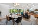 Open living room with dining area, views of the pool, and modern furnishings at 4408 N 28Th Pl, Phoenix, AZ 85016