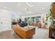 Spacious living room with wood floors, skylight, modern furniture, and access to the backyard at 4408 N 28Th Pl, Phoenix, AZ 85016