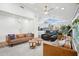 Bright living room with high ceilings, modern decor, and seamlessly connected to the kitchen and dining area at 4408 N 28Th Pl, Phoenix, AZ 85016