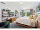 Serene main bedroom with large windows, natural light, and a cozy seating area at 4408 N 28Th Pl, Phoenix, AZ 85016