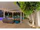 Covered patio with seating and lighting overlooking landscaped backyard with a new pool at 4408 N 28Th Pl, Phoenix, AZ 85016