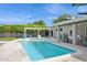 Refreshing swimming pool with lounge chairs, an outdoor shower, and a charming pergola for relaxation at 4408 N 28Th Pl, Phoenix, AZ 85016