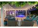 Relaxing outdoor pool area with stylish lounge furniture and charming string lights for evening enjoyment at 4408 N 28Th Pl, Phoenix, AZ 85016