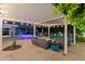 Inviting backyard with covered patio, lounge furniture, and a sparkling pool with color-changing lights at 4408 N 28Th Pl, Phoenix, AZ 85016