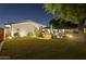 Manicured side yard featuring lush green grass and mature trees providing shade and privacy at 4408 N 28Th Pl, Phoenix, AZ 85016