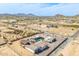 Expansive aerial view featuring a custom home, RV parking, pool, desert landscape, and mountains at 447 W Judd Rd, San Tan Valley, AZ 85143