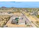 Wide aerial view showcases custom home, pool, desert landscape, and beautiful mountain views at 447 W Judd Rd, San Tan Valley, AZ 85143