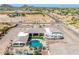 A sprawling desert estate with a swimming pool, an RV, and ample outdoor living spaces at 447 W Judd Rd, San Tan Valley, AZ 85143