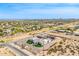 Birds eye view of a desert property with home, pool, playground, and desert landscape at 447 W Judd Rd, San Tan Valley, AZ 85143