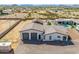 Aerial shot of a two-car garage attached to an accessory building on a sprawling desert property at 447 W Judd Rd, San Tan Valley, AZ 85143